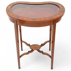Edwardian satinwood kidney-shaped bijouterie table, hinged lid with glazed panel enclosed by floral painted frame, on square tapering supports decorated with trailing bell flowers, united by shaped stretchers and oval tier painted with ribbon and trumpets 