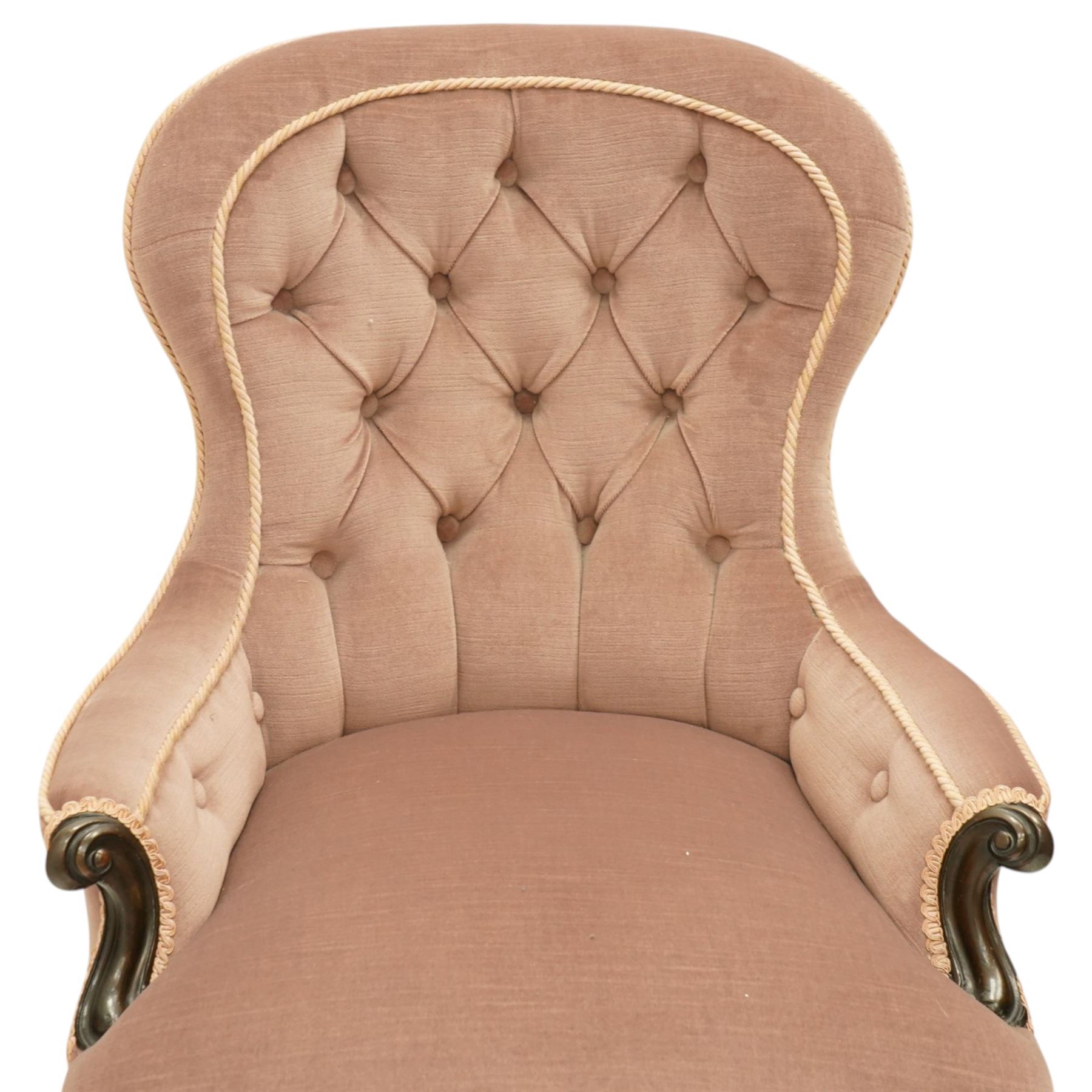 Pair of Victorian mahogany framed salon armchairs, spoon-back and sprung seat upholstered in buttoned lavender velour fabric with pink piping, shaped apron on cabriole legs with scroll feet and ceramic castors