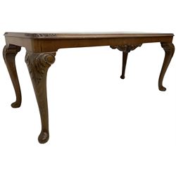Early to mid-20th century figured walnut coffee table, rectangular top with rounded corners, on scrolled acanthus carved cabriole supports