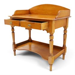 Victorian pine washstand, raised three quarter galleried top, fitted with two drawers, raised on turned supports united by a shaped full length under tier 