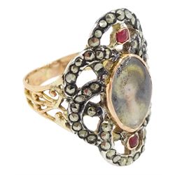 19th century gold and silver marcasite portrait ring, set with an oval miniature of a woman on ivory, under a glazed panel, with a marcasite and red stone set crossover surround, with pierced gold shoulders and reeded shank. This lot has been registered for sale under Section 10 of the APHA Ivory Act