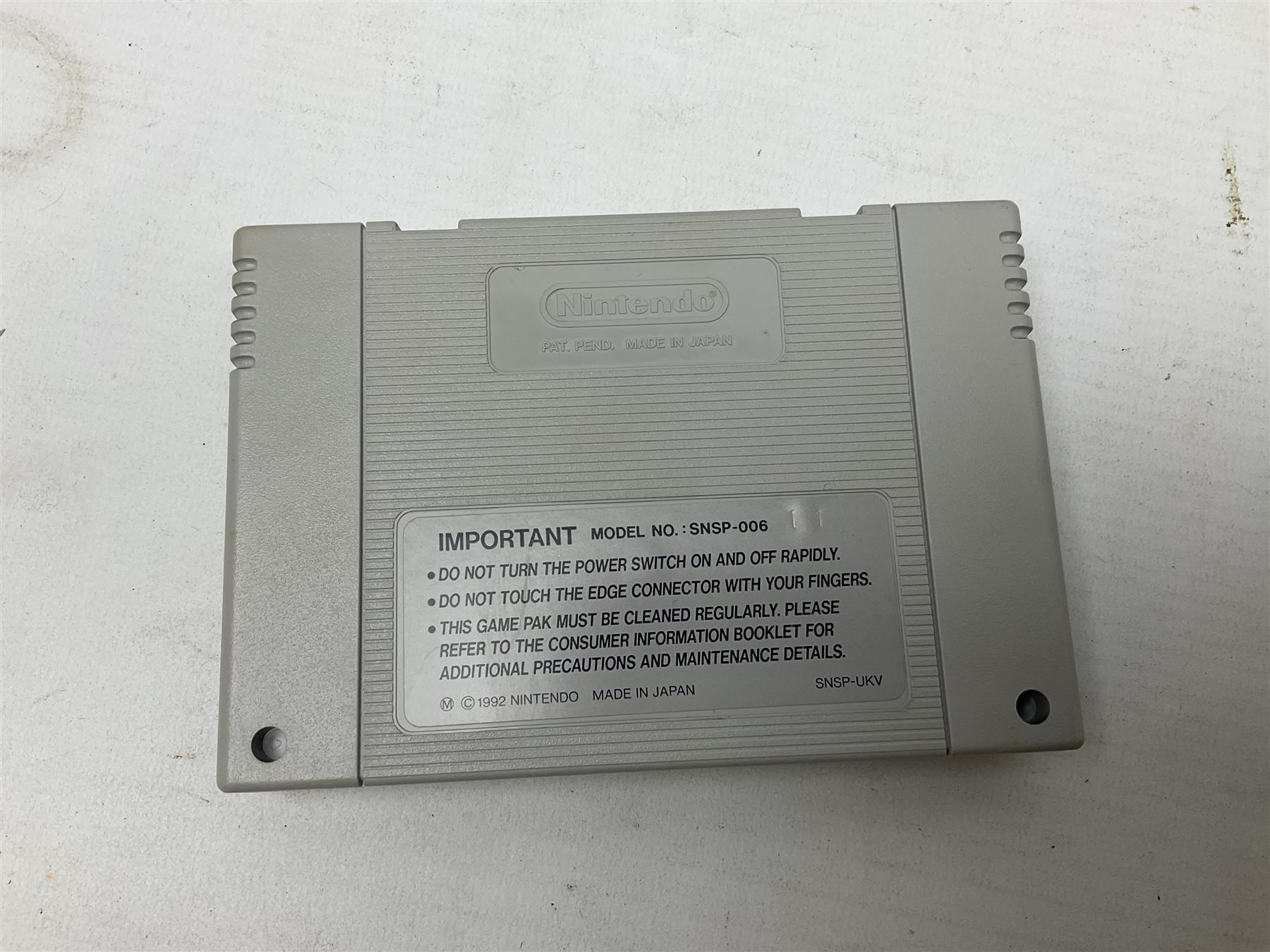 Two Super Nintendo Entertainment System (PAL) controllers, accessories and games. Super NES Game Commander with original box and instruction booklet, Super NES Nintendo Scope (1992) transmitter gun, receiver, Super NES Nintendo Scope 6 game with original instruction booklets. Further games to include ‘The Legend of Zelda a Link to the Past’, ‘Super Mario World’, ‘Super Mario Kart’, ‘The Lawnmower Man’, and ‘Exhaust Heat’, all with original instruction booklets. ‘PowerMonger’ and Disney’s ‘Aladdin’ game cartridges only 