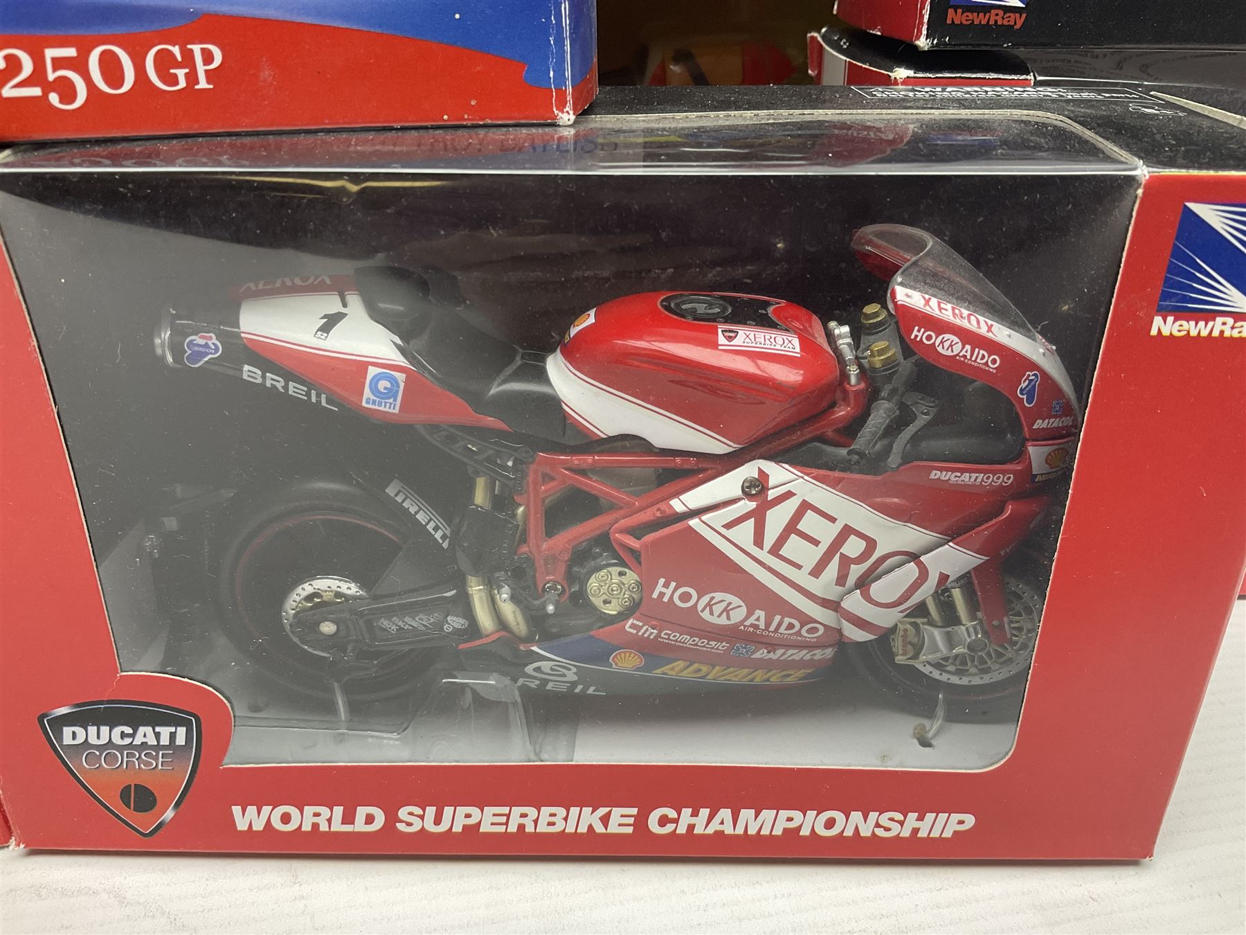 Nine NewRay 1:12 scale die-cast models of motorcycles including Ducati, Honda etc; and four other 1:12 scale die-cast models of motorcycles; all boxed (13)