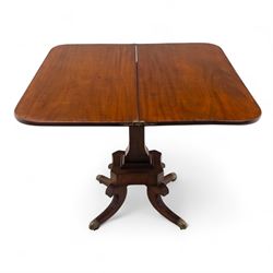 Regency mahogany fold-over table, hinged top with rounded corners opening to reveal a plain polished surface, supported on moulded pedestal base with reeded downswept legs, terminating in brass cups and castors (Extends to 90cm)