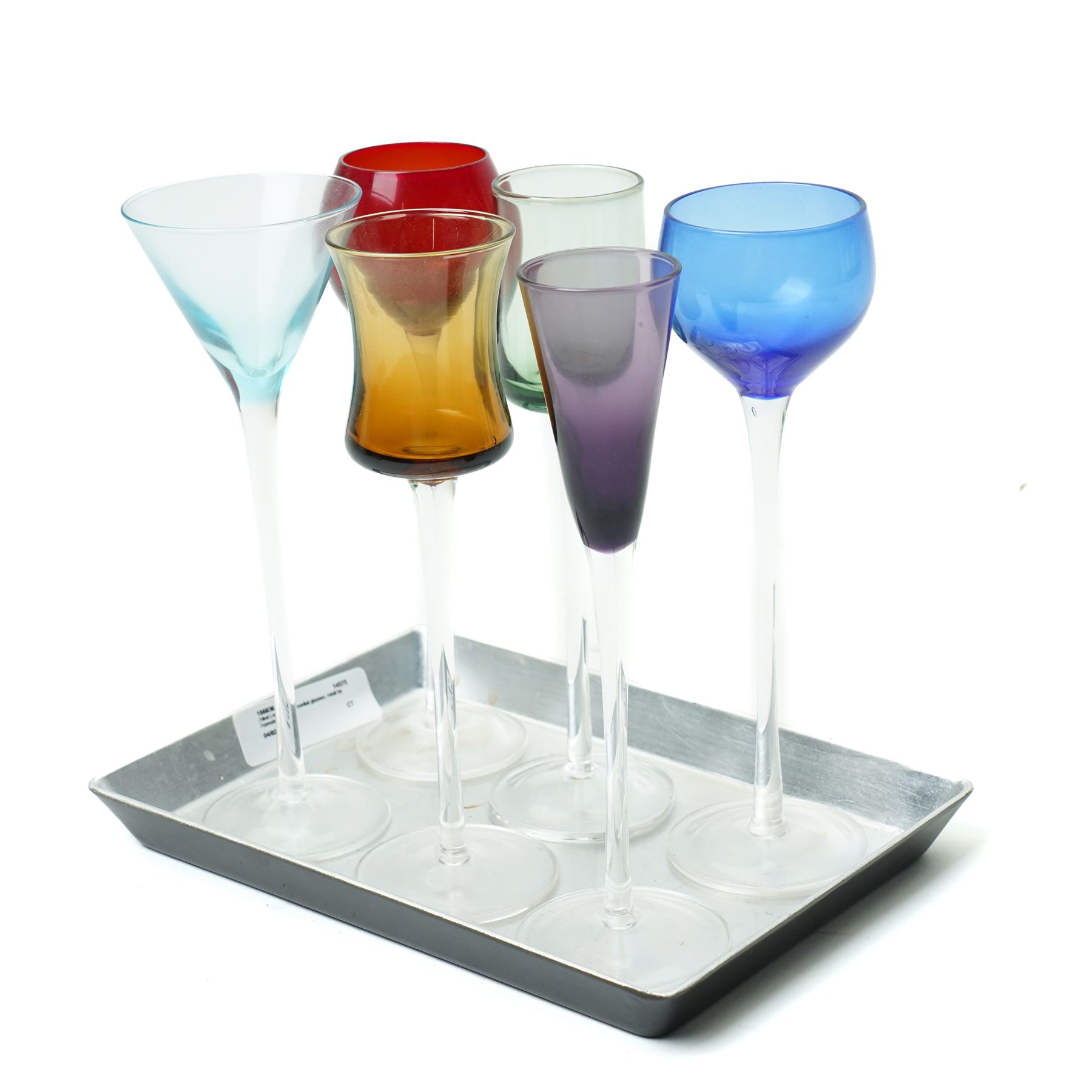   Six cordial glasses each with a different coloured bowl on slender stems understood to be retailed by Harrods on a small lacquered tray
