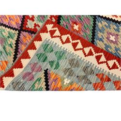 Anatolian Turkish Kilim multi-colour rug, decorated with all over lozenges in contrasting colours with dark indigo outline, the multi-band ivory and red border with repeating geometric shapes and small lozenges or diamonds