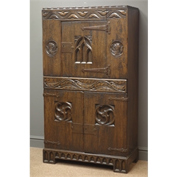  20th century oak chest, Gothic style carvings, two cupboards and centre drawer, W76cm, H138cm, D37cm  