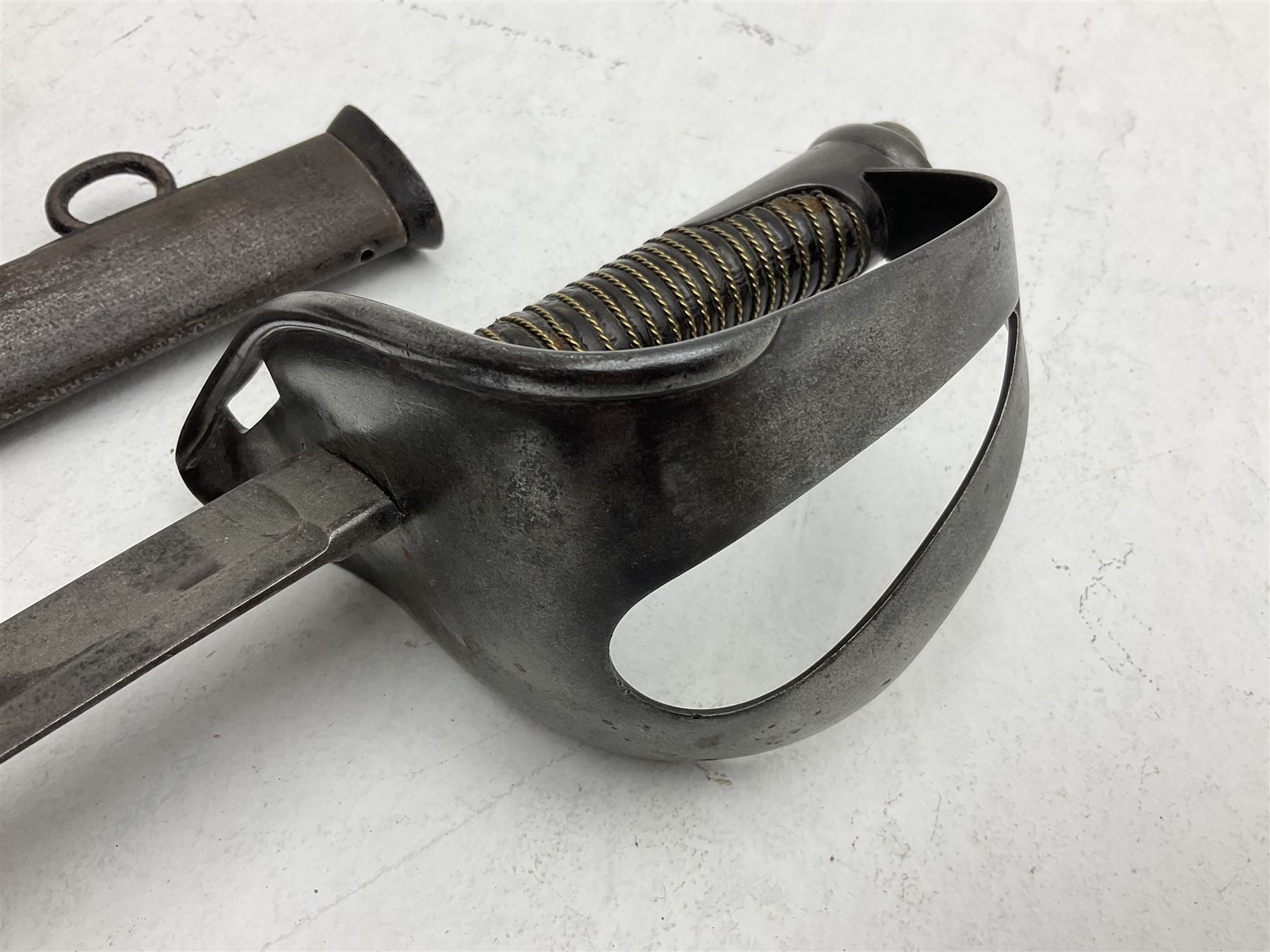 19th century Imperial German army heavy cavalry officers sword by Schnitzler and Kirschbaum, with 89cm single fullered steel blade and sheet steel basket hilt with teardrop cut-out and wire-bound leather grip L107.5cm overall; in steel scabbard with two suspension rings; and British Army 1822 Pattern Infantry Officer's sword in associated scabbard (2)