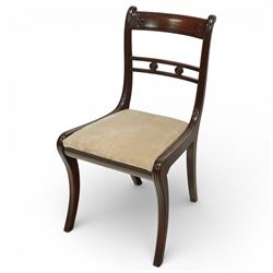 Arthur Brett & Sons - Regency design mahogany extending dining table and eight chairs, the oval top with rounded ends and two extension leaves, raised on twin pedestal supports with swept legs terminating in brass caps and castors, accompanied by a set of eight chairs comprising six single chairs and a pair of carvers, the chairs with curved backs and horizontal splat rails, upholstered seats, sabre legs and scrolling arms to the carvers
(Extends to 252cm)
(Chairs H 86cm, W 52cm)