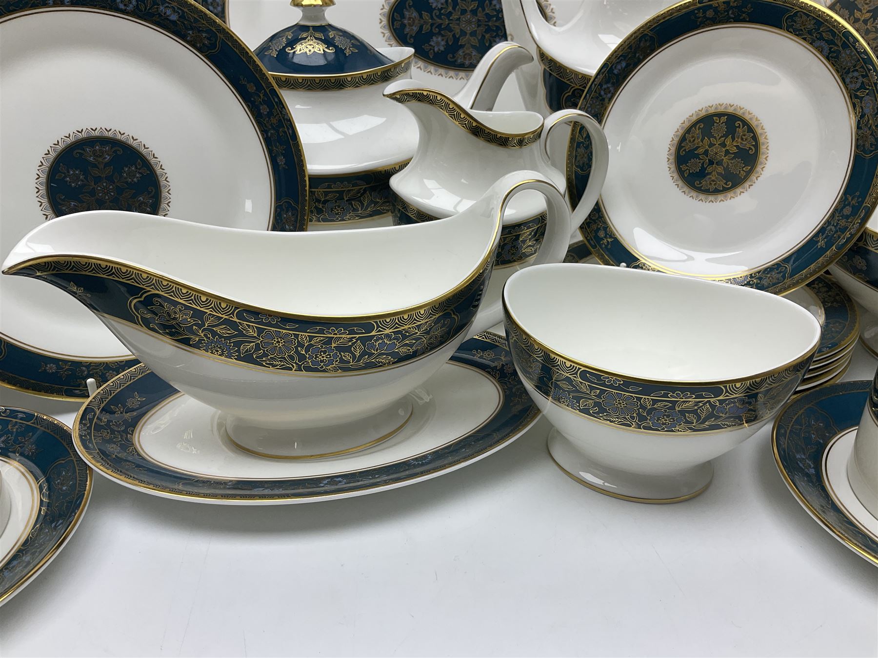 Royal Doulton Carlyle pattern tea and dinner service for six, to include teapot, coffee pot, teacups and saucers, coffee cups and saucers, milk jug, open sucrier, dinner plates, side plates, bowls, soup bowls, to covered dishes etc (64) 