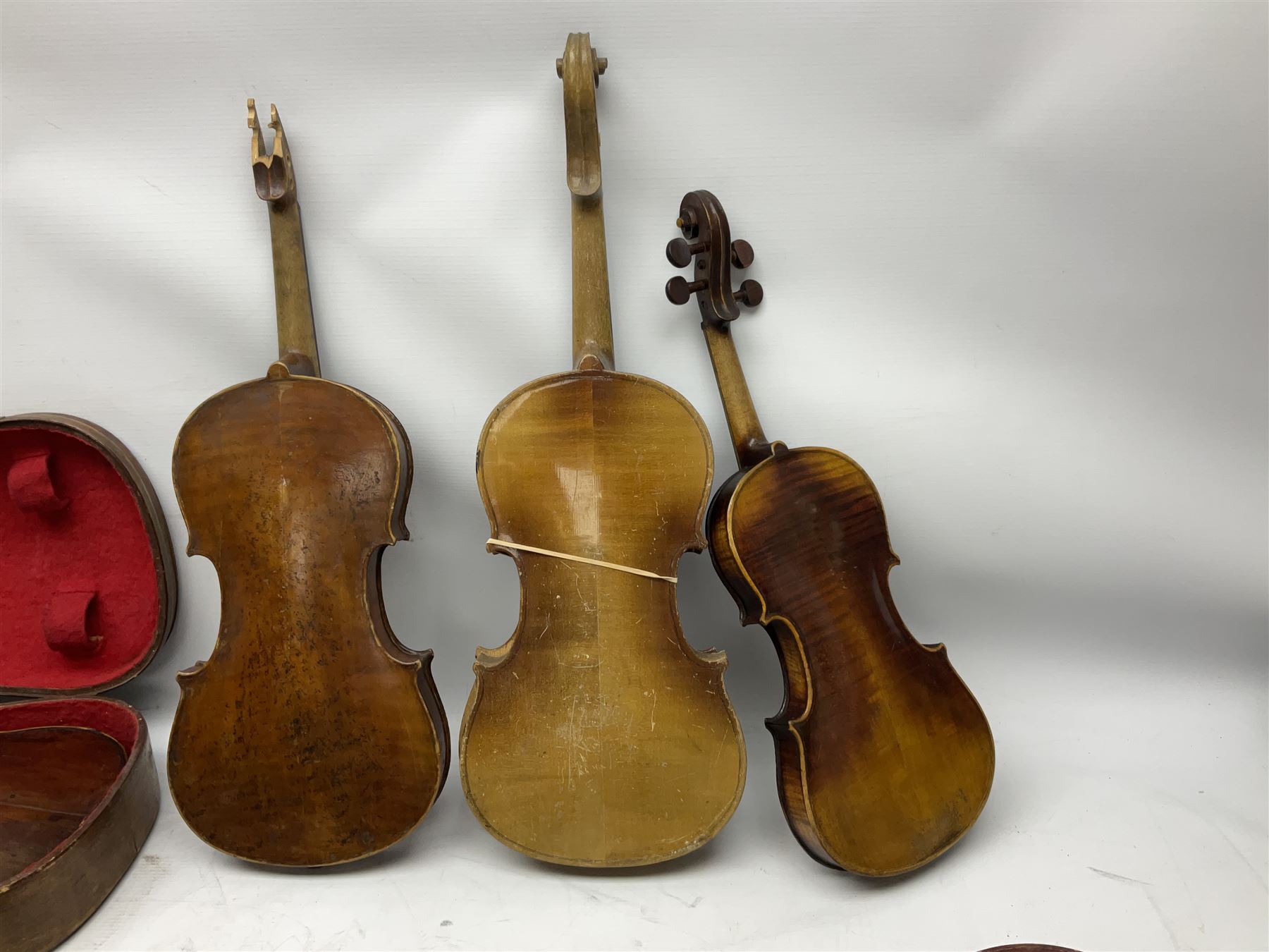 French violin for restoration with 36cm two-piece maple back and ribs and spruce top, bears label 'Lutherie Artistique M. Couturieux'; in wooden case; two modern three-quarter size violins in cases; and five violins for spares or repair