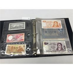 World banknotes, including Queen Elizabeth II The States of Jersey one pound 'DB202703', five pounds 'BB527762' and ten pounds 'AB651481', reserve bank of New Zealand two dollars '1L3 741894', King George V Straits Settlements one dollar 1st January 1935 'F/83 28924', various Bank of England notes etc, housed in two ring binder albums