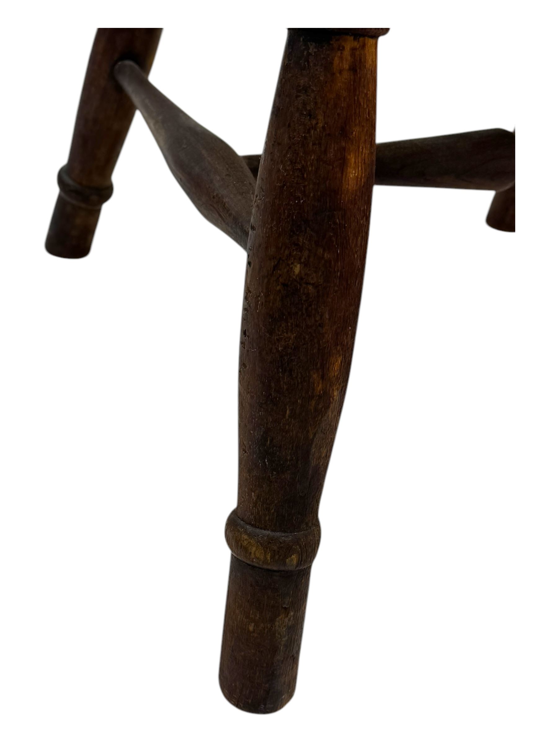 19th century provincial elm and beech Windsor armchair, shaped cresting rail over stick back with pierced and shaped splat, the dished seat on turned supports united by turned stretchers 