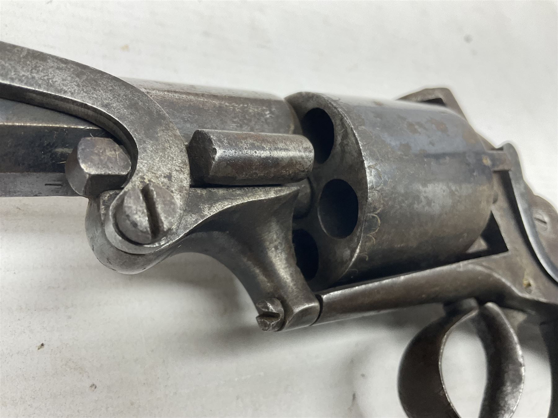 Mid-19th century Smith London .36 cal. transitional five-shot percussion revolver, the 12cm rifled octagonal barrel with side loading lever, side safety, some engraved decoration and chequered two-piece grip L28cm overall