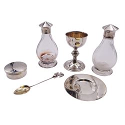 Mid 20th century silver travelling communion set, comprising chalice, paten, wafer box, spoon, and pair of silver mounted glass bottles, chalice, paten, wafer box, and spoon hallmarked A R Mowbray & Co Ltd, London 1960, screw threaded interiors to bottles marked with leopard head and lion passant, contained within a fitted travelling case with carry handle, approximate weighable silver 4.29 ozt (133.5 grams)

