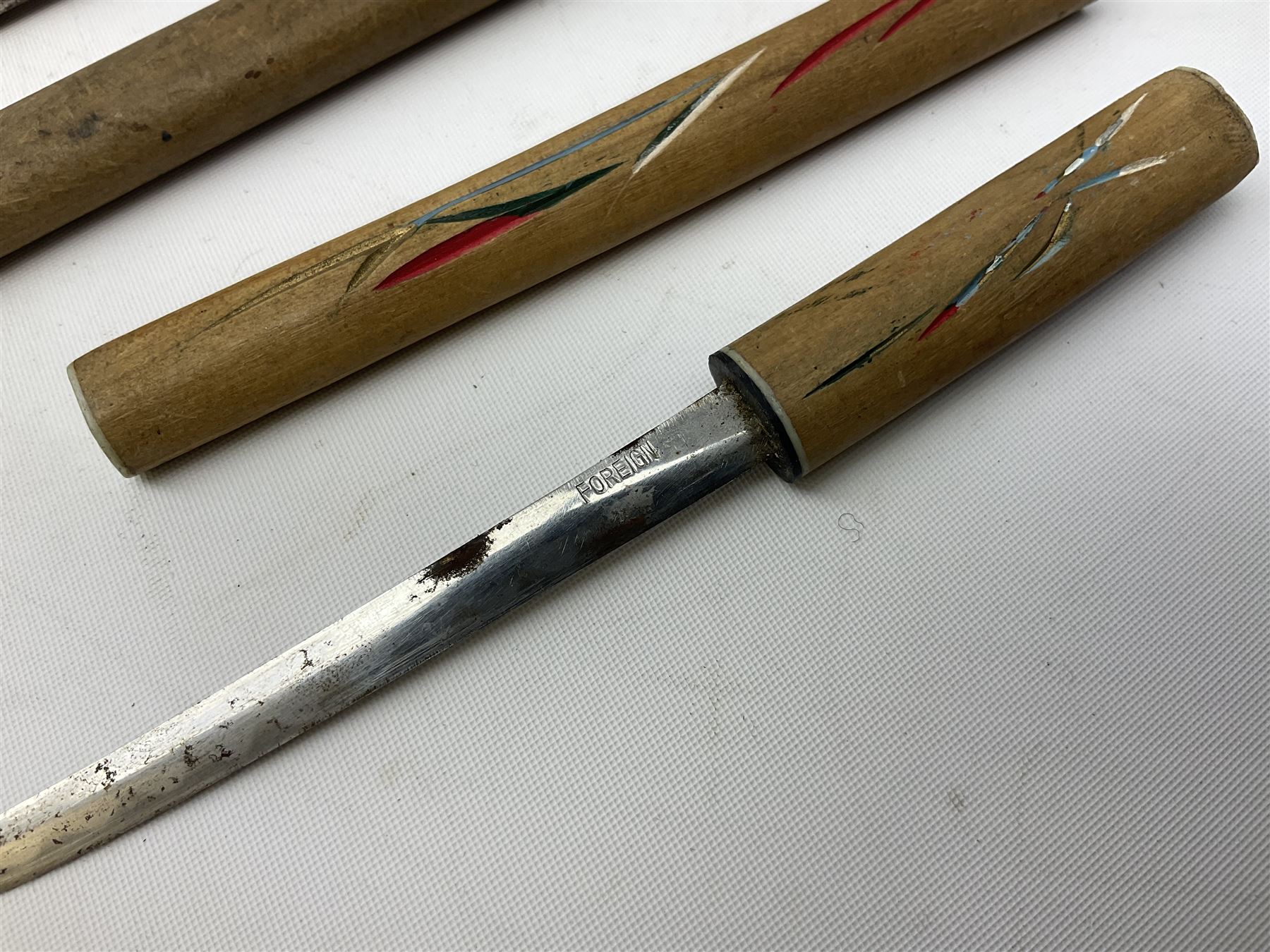 Malayan Kris dagger, the 31.5cm double edged straight heavy damascus blade with copper ferrule; carved hardwood grip; in large wooden throated scabbard with floral decorated white metal covering L47.5cm overall; a kris blade with adapted antler grip; and five various small daggers/letter openers (7)