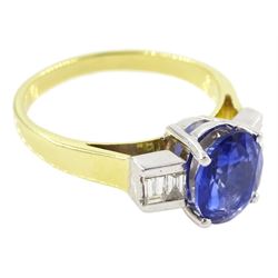 18ct gold tanzanite and diamond ring, single stone oval cut tanzanite of approx 1.75 carat, with two baguette cut diamonds set either side, stamped 750