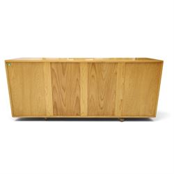 Ercol - mid-20th century light elm and beech Windsor 'model 455' sideboard, rectangular top over three central drawers flanked by cupboards, on castors