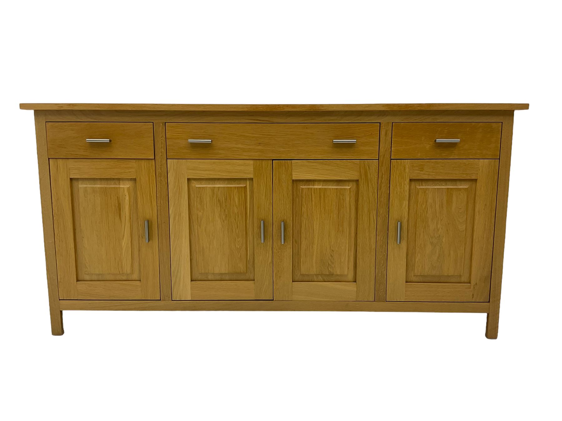 G-Plan - light oak sideboard, fitted with three drawers and four panelled cupboards