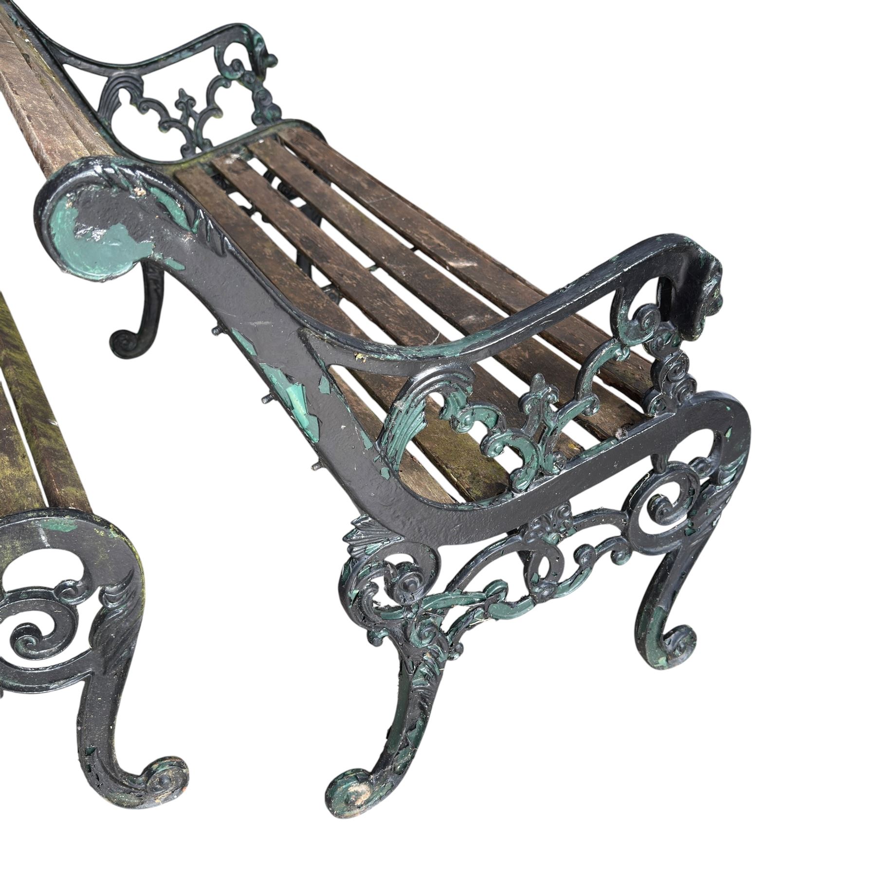 Pair of Victorian Revival Coalbrookdale design 'Dog and Serpent' pattern benches with slatted seats, the cast iron end supports of pierced and scrolling design with dog mask arm terminals