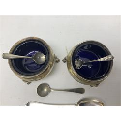 Pair of early 20th century silver open salts, of cauldron form, each with blue glass liner, silver teaspoon, and silver salt spoon with shell bowl, etc., approximate total silver weight 106.5 grams