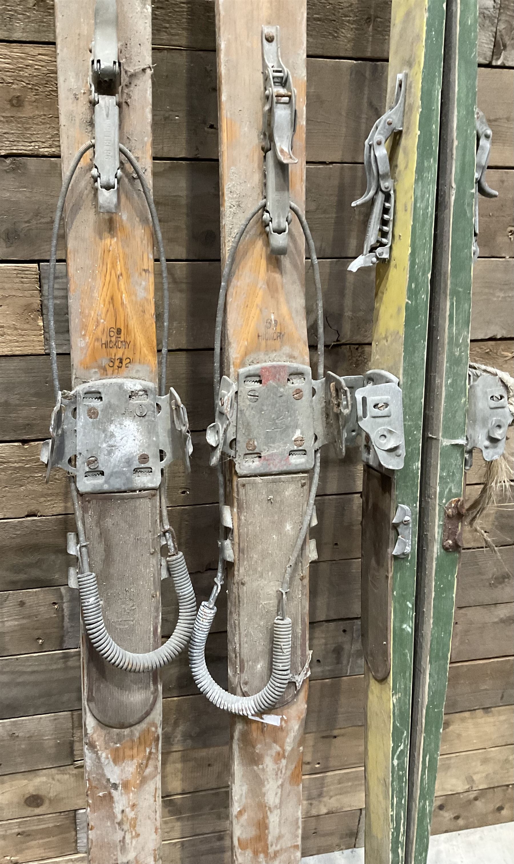 Two pairs of vintage skis, L207cm and 197cm