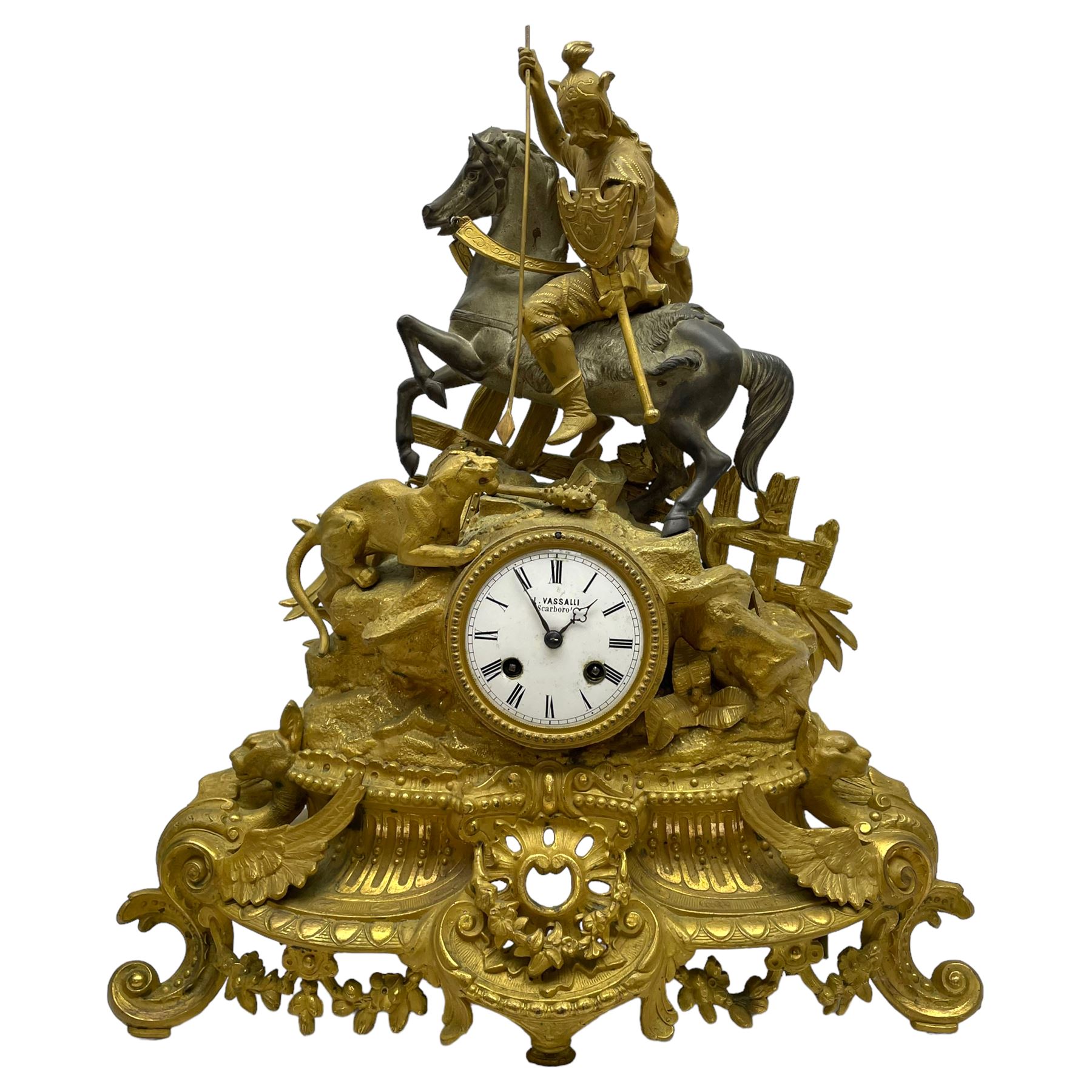 French - late 19th century 8-day gilt spelter mantle clock retailed by J Vassalli of Scarborough c1890, sculptured with an oriental 16th century representation a Mughal warrior slaying a leopard, raised on a profusely  decorated base with scroll work and splayed feet, white enamel dial with Roman numerals, minute track and steel hands, Parisian twin train countwheel striking movement, striking the hours and half-hours on a bell. With pendulum & Key.  