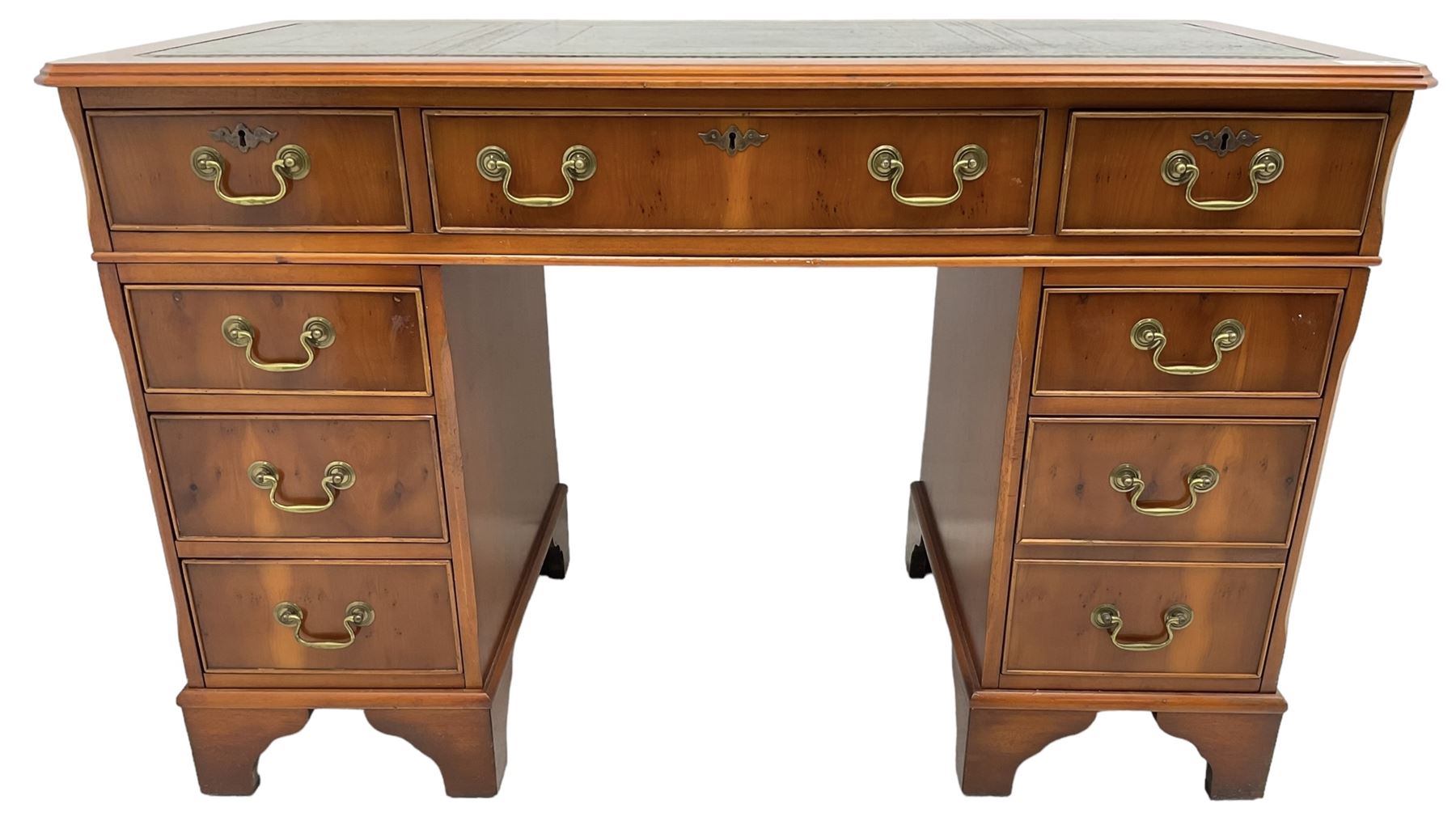 Georgian design yew wood twin pedestal desk, rectangular top with green leather inset writing surface, fitted with nine cock-beaded drawers, on bracket feet