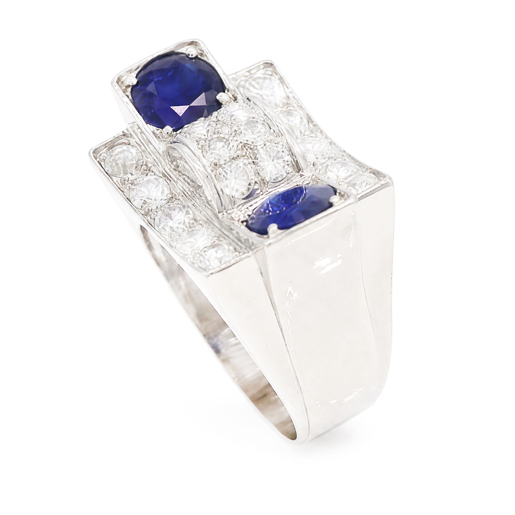 Platinum sapphire and diamond abstract design dress ring, pave set with eighteen old cut and round brilliant cut diamonds, with two mixed cut sapphires at each end, in a curved design setting, total sapphire weight approx 2.68 carat, total diamond weight approx 1.95 carat, with World Institute Report