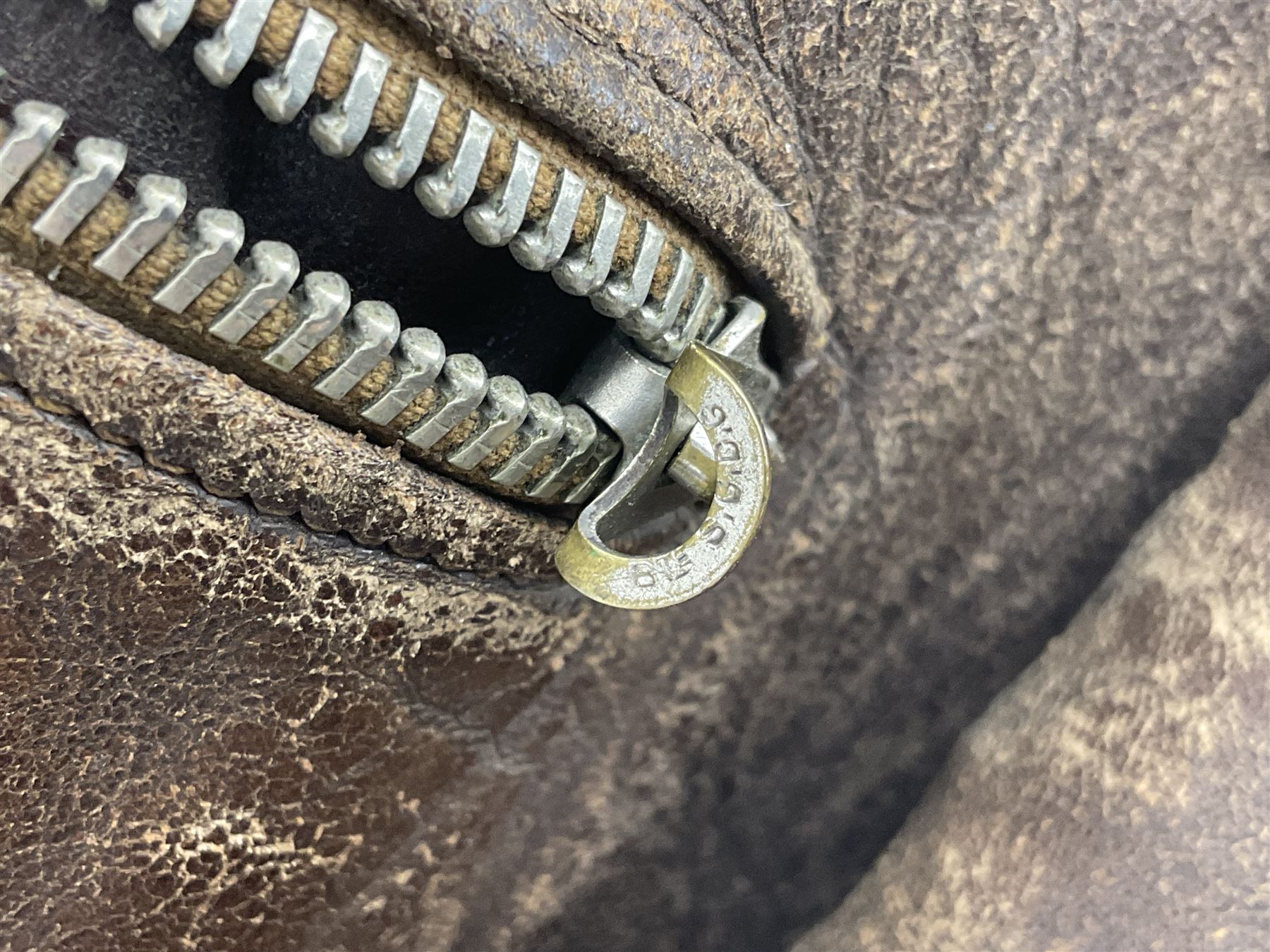 German Luftwaffe Hartmann leather jacket with tartan pocket linings, pocket zip pulls marked 'Eclair Bte.S.G.D.G.'