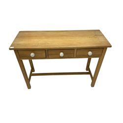 Light oak side table, fitted with three drawers, and ceramic handles