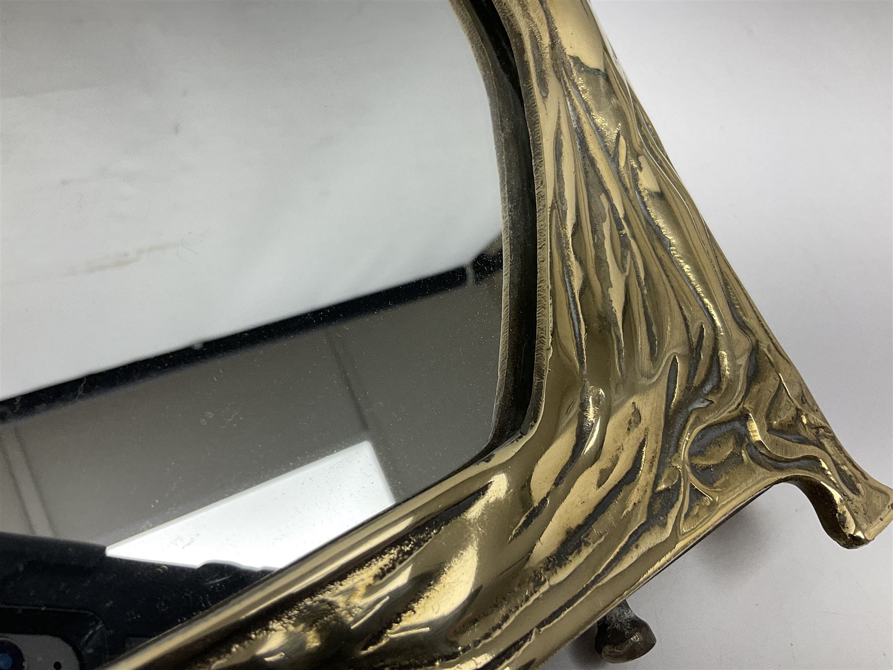 Art Nouveau style mirror in the manner of WMF, decorated with a female figure and floral motifs, the easel support verso with spurious WMF, H35cm