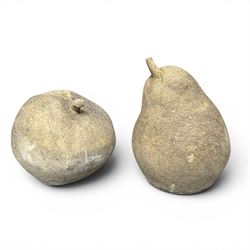 Pair of weathered cast stone garden models of fruit, in the form of an apple and pear