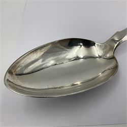 Victorian Newcastle silver Fiddle Shell pattern serving spoon, the terminal engraved with crest of a fist holding an arrow aloft, hallmarked Lister & Sons, Newcastle 1862, L31cm