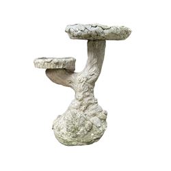 Two cast stone tree bird baths