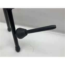 Four folding tubular guitar stands, two by RockJam; and folding tubular saxophone stand (5)