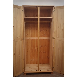  Solid pine double wardrobe, two doors enclosing fitted interior, bun feet, W82cm, H180cm, D51cm  