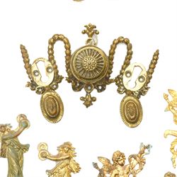 Victorian brass double key door plate by Thomas Elsley, possibly for a safe, three brass curtain tie backs formed as garlands, four brass cherub door plates marked 'H.V.' , four others similar and four others of female figures playing cymbals 
Provenance: property of a Nobleman