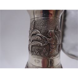 20th century Indian silver mounted decanter, with repousse and chased decoration to body depicting agricultural scenes, upon circular foot, with integral glass liner and cylindrical stopper, stamped Sterling to base, H24.5cm