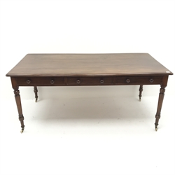Victorian mahogany library table, moulded top, three drawers, turned supports on castors, W184cm, H79cm, D91cm 