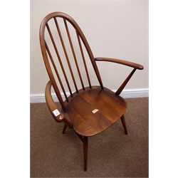  Set six (5+1) elm Ercol high hoop back dining chairs (W42cm) and an elm drop leaf oval table, square supports joined by an 'X' stretcher (W114cm, H72cm, D125cm)  