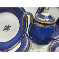Wedgwood part tea and coffee service, comprising coffee pot, six coffee cans with five saucers, seven teacups with ten saucers and seven side plates, each decorated with floral bouquet to centre, in a gilt and speckled blue border, pattern x9933, with printed mark beneath