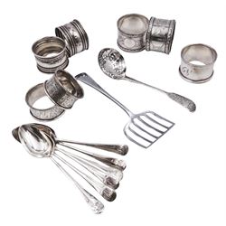 Group of silver, comprising set of six 1930's golfing terminal coffee spoons, hallmarked Cooper Brothers & Sons Ltd, Sheffield 1931, 1932 and 1933, a Victorian Fiddle pattern sifting spoon with foliate to handle, hallmarked Wakely & Wheeler, London 1889, an early 20th century sardine server hallmarked James Dixon & Sons Ltd, Sheffield 1911, and a group of seven early 20th century napkin rings, to include three pairs, various hallmarks, dates ranging from 1903 to 1922, approximate total weight 9.90 ozt (308 grams)
