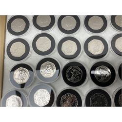 Thirty-seven commemorative fifty pence coins, including 2011 wrestling, other Olympics, Beatrix Potter etc, housed in capsules