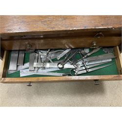 Six shelved cabinets for displaying ‘00’ gauge locomotives comprising plain plywood and white painted examples with track applied to various shelves, largest H63cm, W107cm, D27cm; Collection of tools for building model locomotives to include Weller PU-2D Soldering Pencil and Standard Tip Soldering Iron 20W/230V, Humbrol Modellers Airbrush, Power Supply Units and two wooden chests one of which housing a collection of tools including tweezers, scalping tools, wrenches etc 