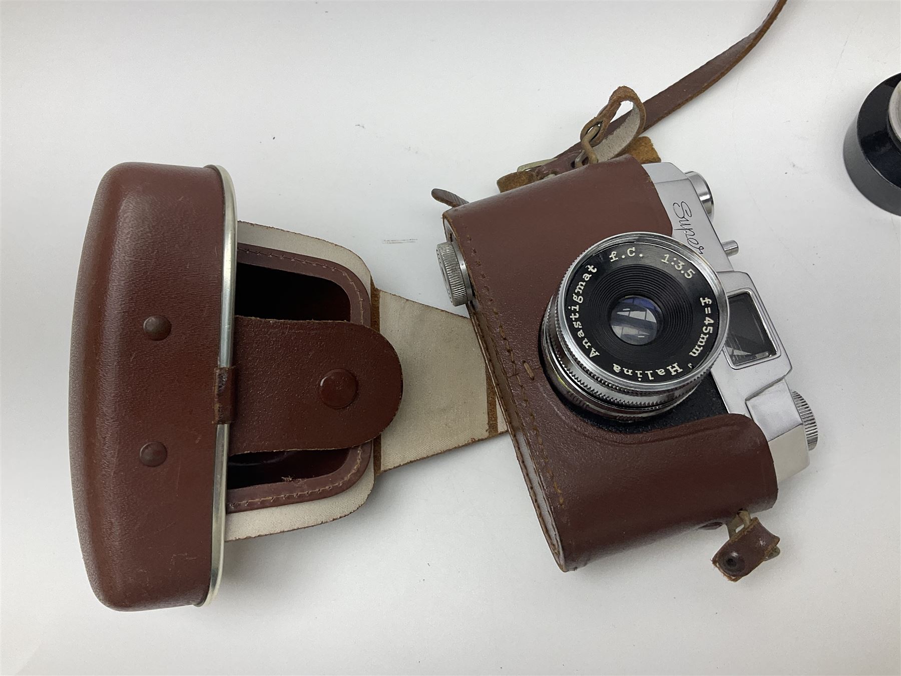 Canon EOS 50e camera body, serial no 8305671 with 'Canon Zoom EF 35-135mm 1:4-5.6' lens together with Halina 35X super camera body, with 'Halina Anastigmat f.c. 1:3.5 f=45mm' lens and other camera equipment 