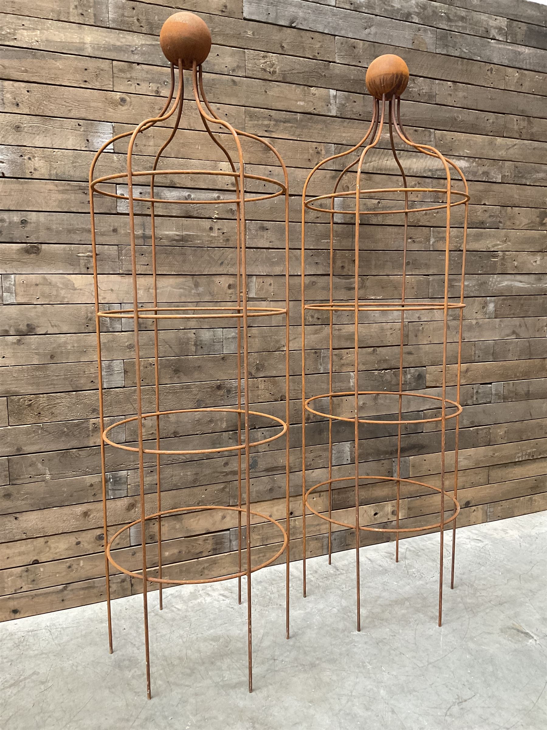 Pair of Country House wrought iron garden obelisks with ball finial, raise in four tiers