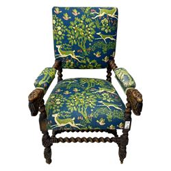 19th century Carolean design oak armchair, upholstered in a vibrant fabric depicting woodland and wildlife scenes, carved lion mask arm terminals, raised on barley twist supports united by H-stretcher