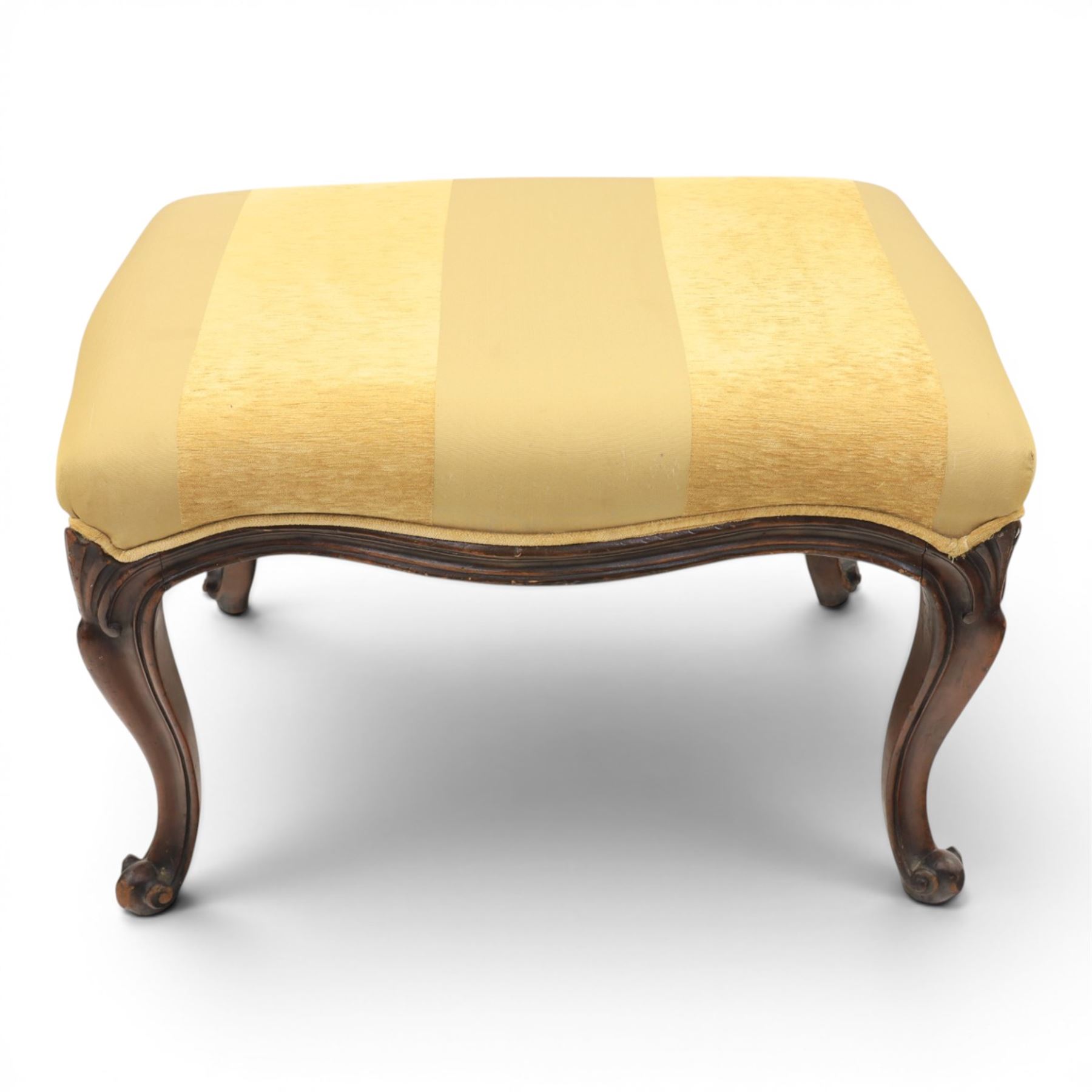 Victorian mahogany Cayley style footstool, serpentine upholstered seat raised on cabriole supports terminating in scroll feet