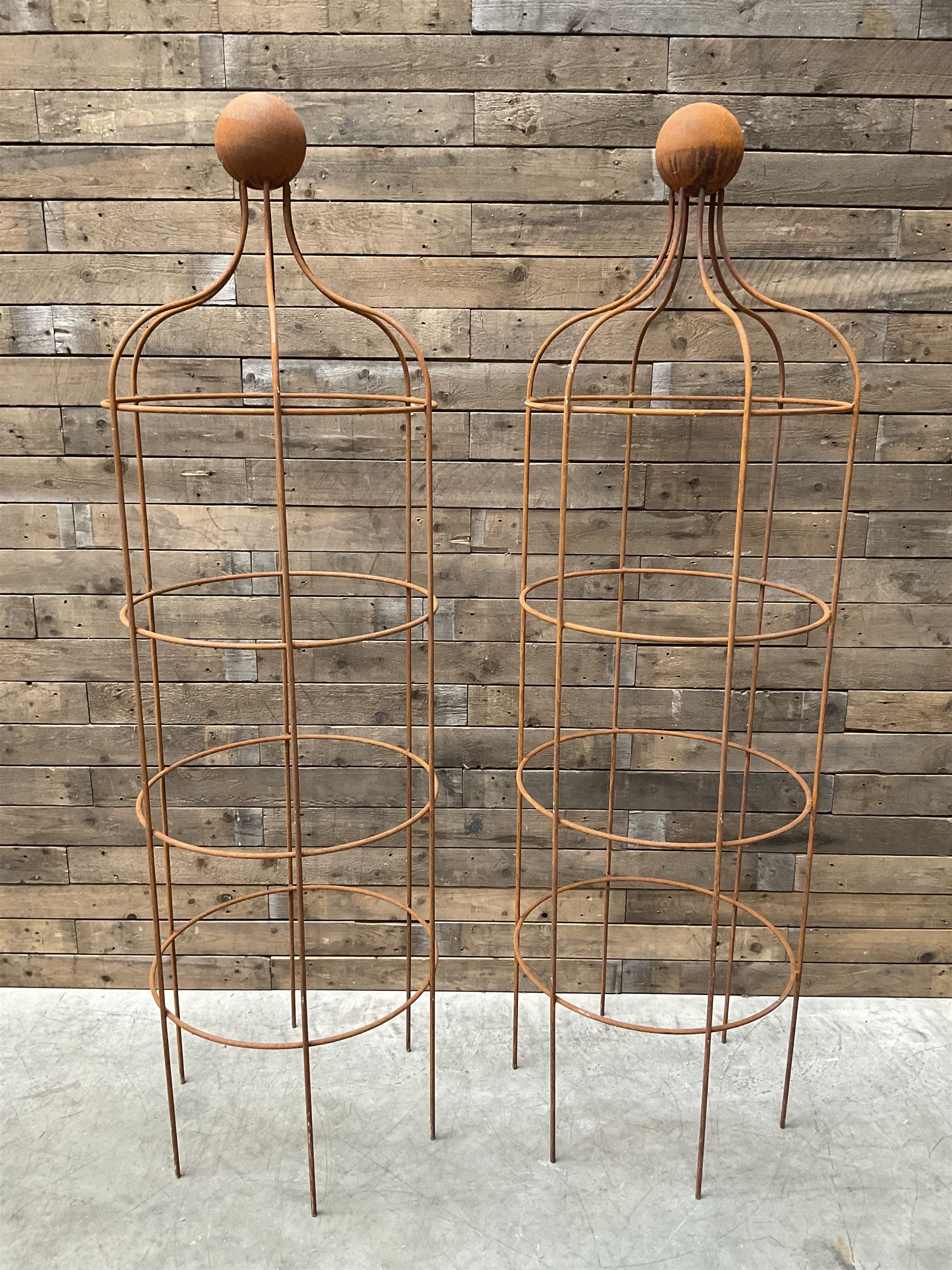 Pair of Country House wrought iron garden obelisks with ball finial, raise in four tiers